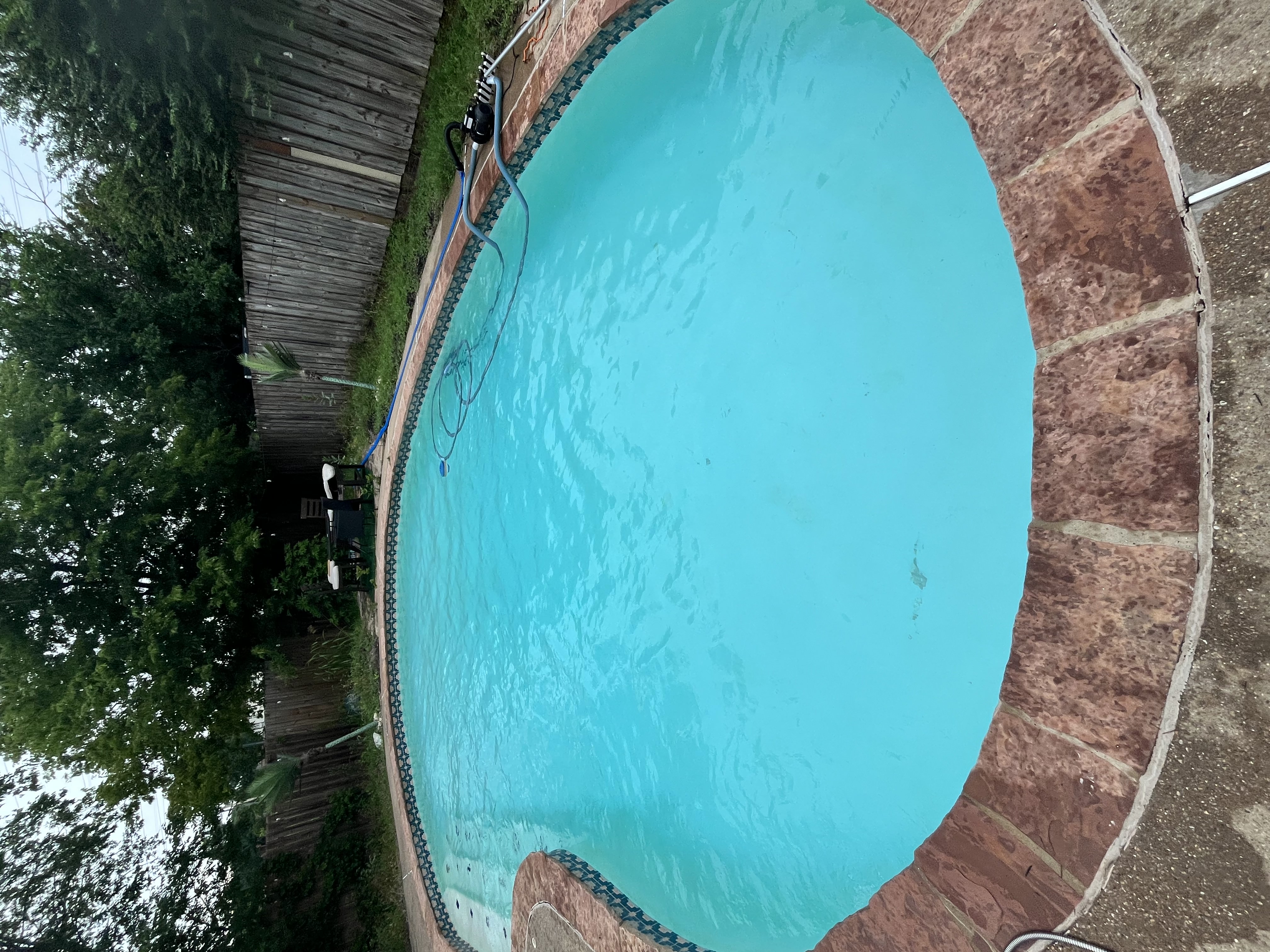 Automatic pool vacuum and skimmer basket service during weekly pool cleaning in DeSoto TX